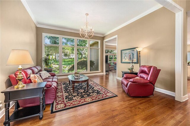 5484 NE Northgate Xing, Lees Summit, MO 64064 - living room featuring a chandelier, wood finished floors, crown molding, and baseboards