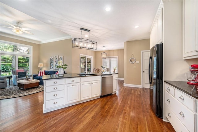 5484 NE Northgate Xing, Lees Summit, MO 64064 - kitchen with dishwasher, freestanding refrigerator, a sink, dark wood-style floors, and white cabinetry