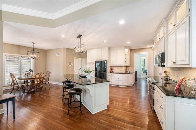 5484 NE Northgate Xing, Lees Summit, MO 64064 - kitchen featuring black fridge with ice dispenser, baseboards, stainless steel microwave, dark wood-style floors, and a chandelier