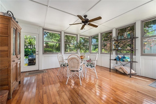5484 NE Northgate Xing, Lees Summit, MO 64064 - sunroom with wood-type flooring, a decorative wall, and a wooden deck