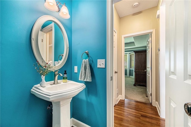 5484 NE Northgate Xing, Lees Summit, MO 64064 - bathroom featuring baseboards and wood finished floors