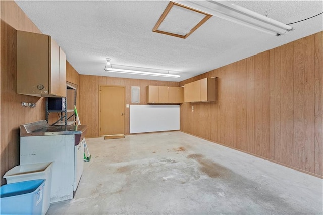 501 N Stone Blvd, Raymore, MO 64083 - garage with wood walls