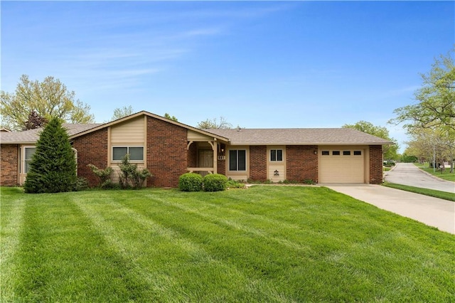 501 N Stone Blvd, Raymore, MO 64083 - single story home with an attached garage, a front lawn, brick siding, and concrete driveway