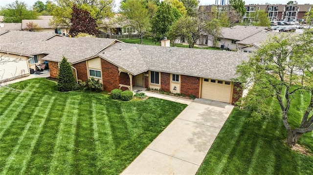 501 N Stone Blvd, Raymore, MO 64083 - ranch-style house with brick siding, a shingled roof, an attached garage, and a front yard