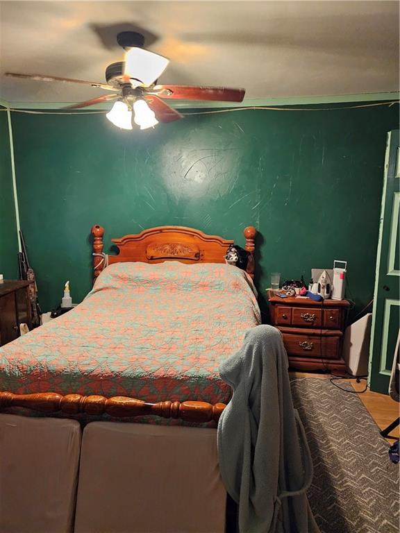 30740 W 83rd St, De Soto, KS 66018 - bedroom featuring wood finished floors and a ceiling fan