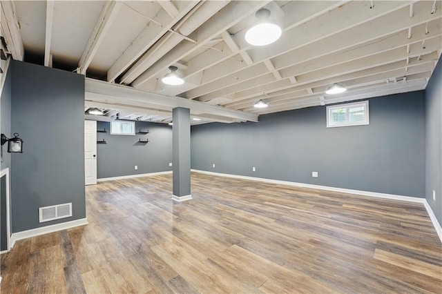 5700 N 123rd St, Kansas City, KS 66109 - basement featuring plenty of natural light, wood finished floors, and baseboards