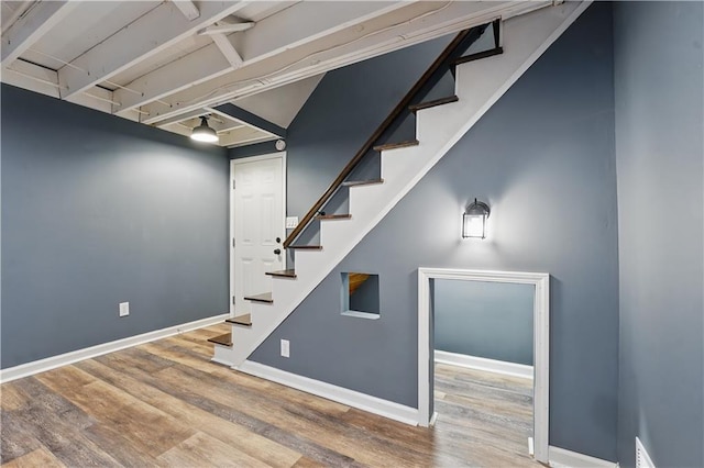 5700 N 123rd St, Kansas City, KS 66109 - below grade area with wood finished floors, stairway, and baseboards
