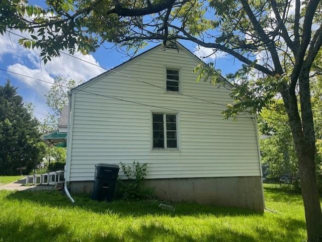 4748 Eastern Ave, Kansas City, MO 64129 - view of property exterior with a yard