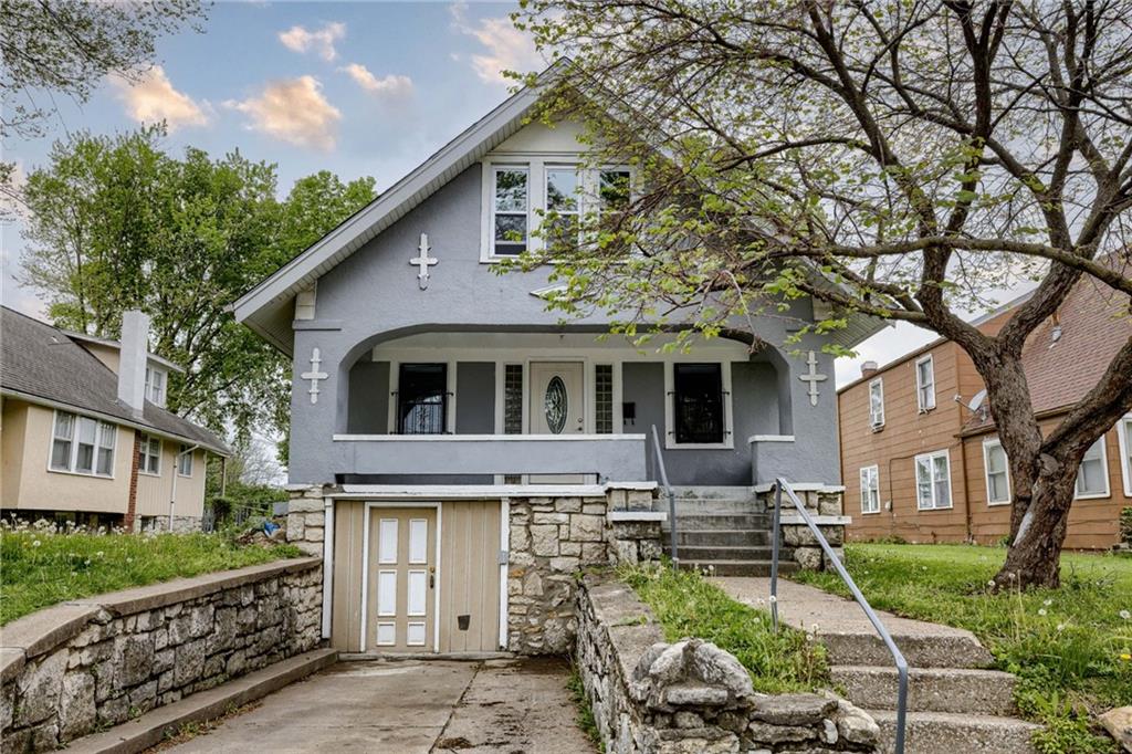 back of property featuring stucco siding and a porch
