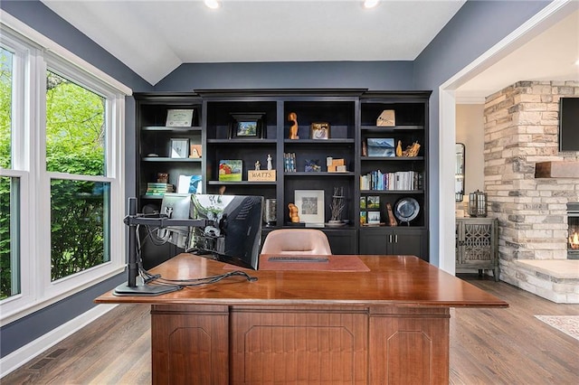 office featuring wood finished floors and vaulted ceiling
