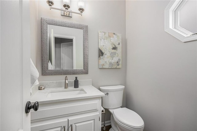 half bath with toilet and vanity