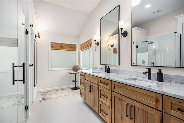 full bathroom with lofted ceiling, a stall shower, double vanity, and baseboards