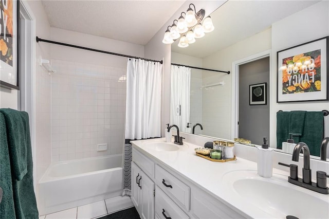 bathroom with tile patterned flooring, shower / bath combo with shower curtain, and double vanity