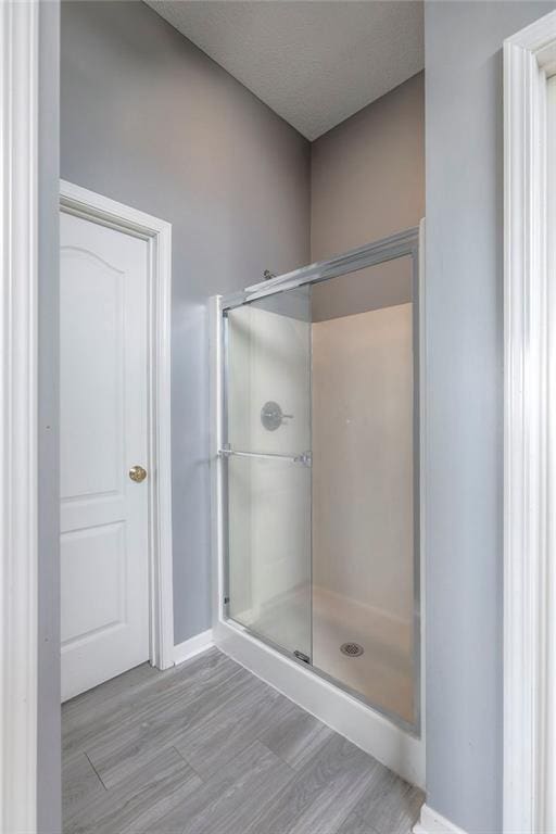 812 SW Stablewood Cir, Lees Summit, MO 64081 - full bath with wood finished floors and a shower stall