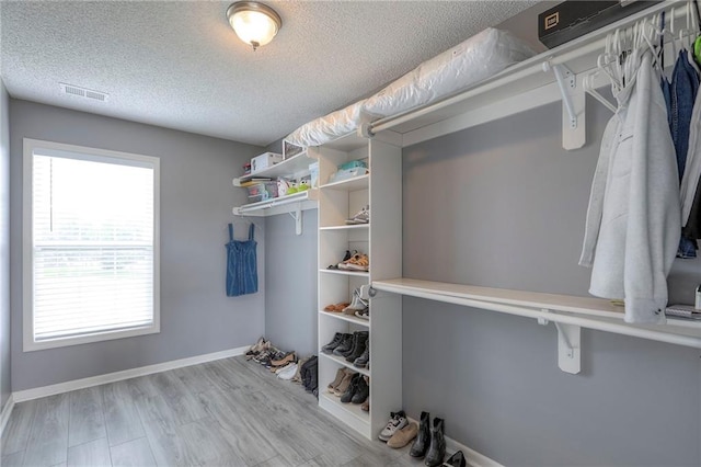 812 SW Stablewood Cir, Lees Summit, MO 64081 - walk in closet with wood finished floors