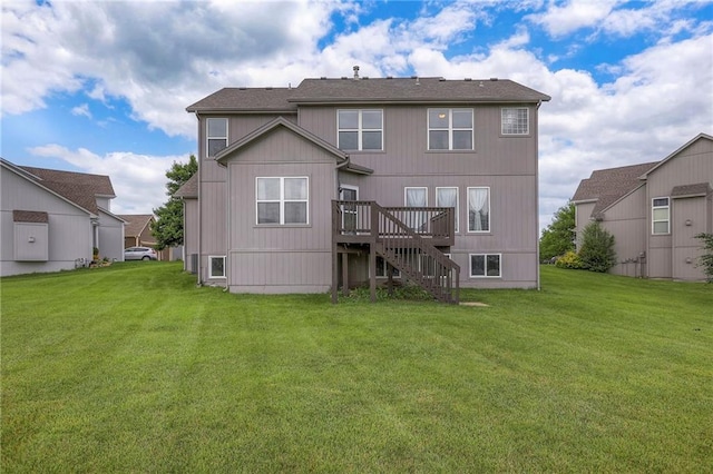 812 SW Stablewood Cir, Lees Summit, MO 64081 - back of property with a wooden deck, a lawn, and stairs