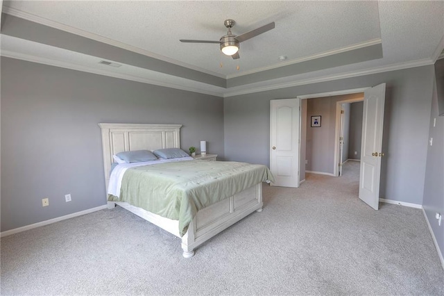 812 SW Stablewood Cir, Lees Summit, MO 64081 - bedroom with ornamental molding, a tray ceiling, a textured ceiling, light colored carpet, and ceiling fan