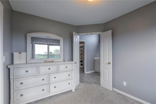 812 SW Stablewood Cir, Lees Summit, MO 64081 - bedroom with light colored carpet and a textured ceiling