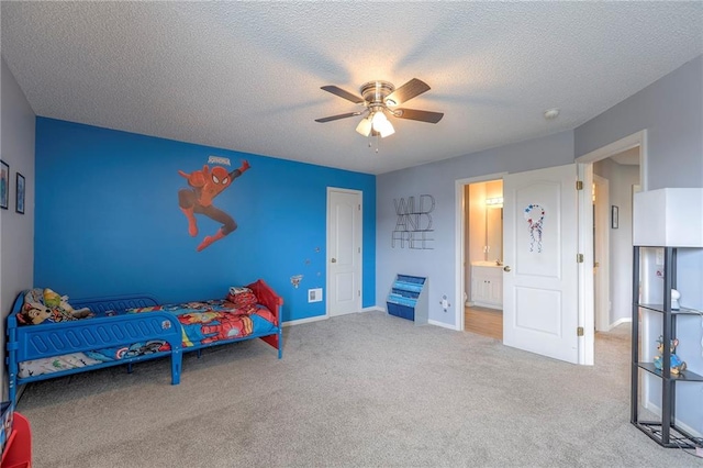 812 SW Stablewood Cir, Lees Summit, MO 64081 - bedroom with carpet flooring, a textured ceiling, ceiling fan, and ensuite bath