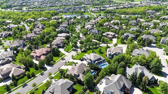 aerial view of residential area featuring a nearby body of water