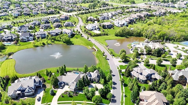 aerial view of residential area with a large body of water