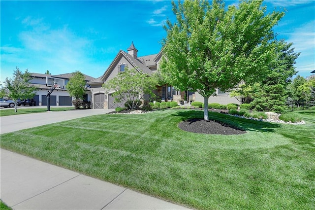 obstructed view of property with driveway, a front lawn, and an attached garage