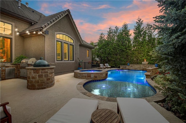 16305 Flint St, Overland Park, KS 66221 - pool at dusk featuring a patio area and a pool with connected hot tub