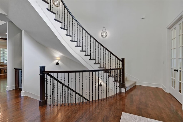 16305 Flint St, Overland Park, KS 66221 - stairs with wood finished floors and baseboards