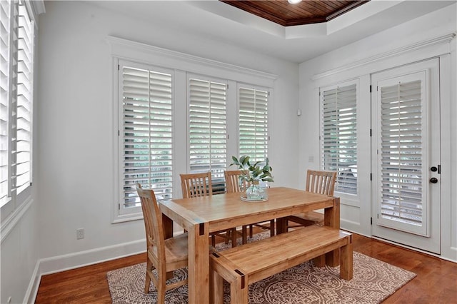16305 Flint St, Overland Park, KS 66221 - dining area featuring wood finished floors, a raised ceiling, healthy amount of natural light, baseboards, and wood ceiling