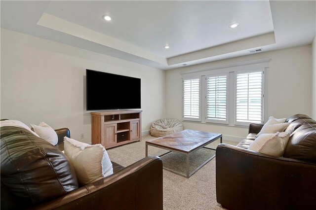 16305 Flint St, Overland Park, KS 66221 - carpeted living room featuring a tray ceiling, recessed lighting, and baseboards