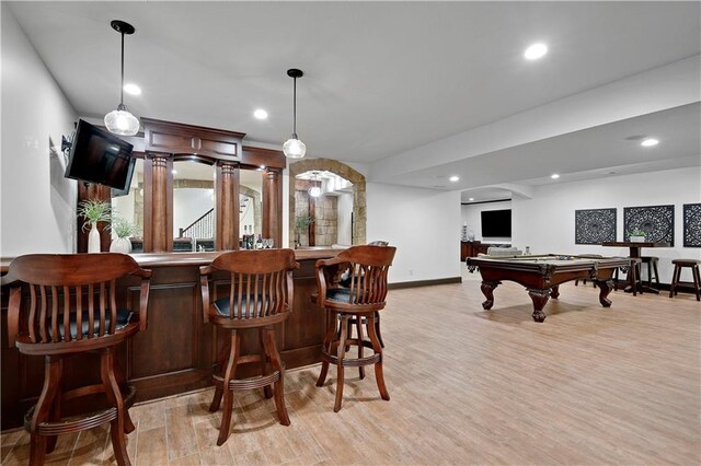 16305 Flint St, Overland Park, KS 66221 - indoor bar with billiards table, light wood-style flooring, baseboards, recessed lighting, and hanging light fixtures