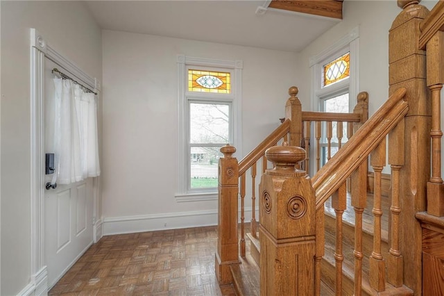 stairway featuring baseboards