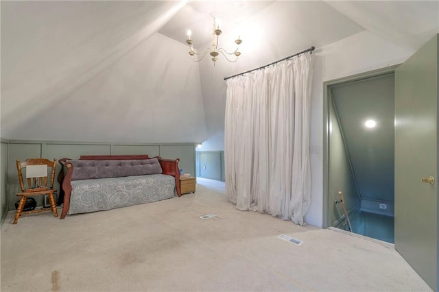 bedroom with visible vents, a notable chandelier, carpet flooring, and vaulted ceiling