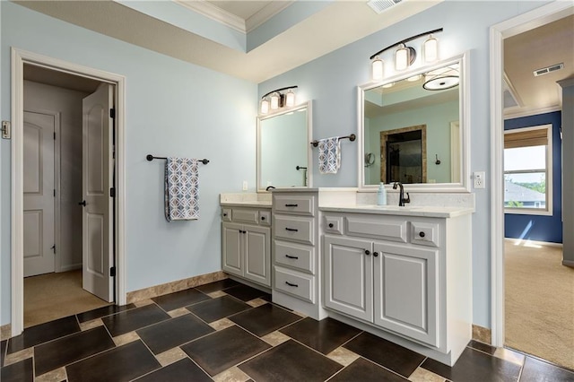 full bathroom featuring crown molding, baseboards, a shower with door, and vanity