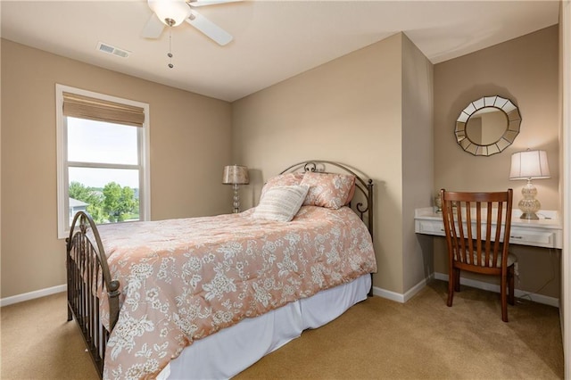 carpeted bedroom featuring baseboards