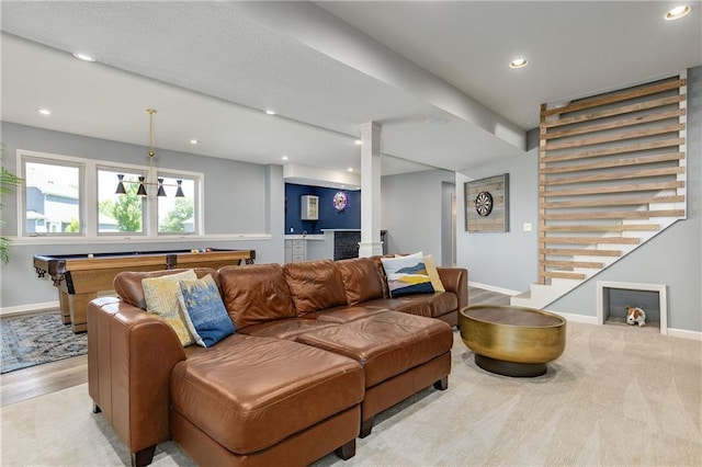 living area featuring baseboards, stairway, billiards, recessed lighting, and decorative columns
