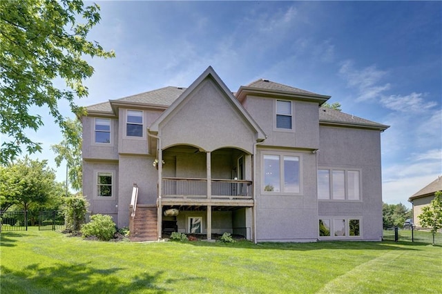 back of house with stucco siding and stairs