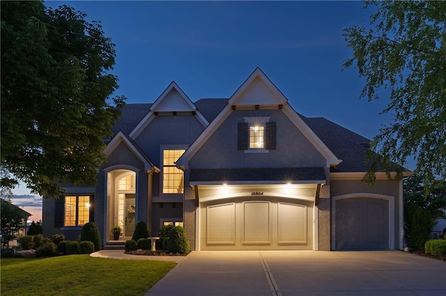 10804 W 169th St, Overland Park, KS 66221 - traditional-style home featuring driveway, stucco siding, and a front yard
