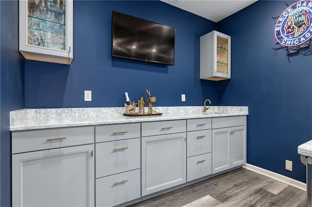 10804 W 169th St, Overland Park, KS 66221 - full bath with double vanity, wood finished floors, and baseboards