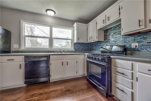 kitchen with black appliances, white cabinetry, tasteful backsplash, and dark wood-style floors
