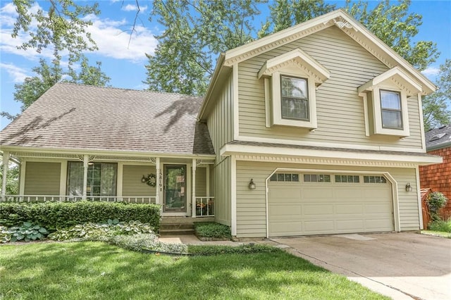 15819 W 147th Ter, Olathe, KS 66062 - view of front facade featuring an attached garage, driveway, a front yard, and a shingled roof