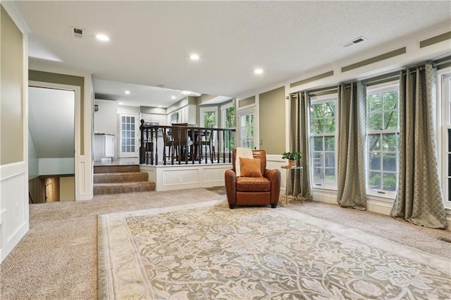 15819 W 147th Ter, Olathe, KS 66062 - sitting room featuring carpet flooring, a decorative wall, recessed lighting, and stairway