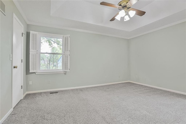 15819 W 147th Ter, Olathe, KS 66062 - carpeted spare room with a tray ceiling, a ceiling fan, ornamental molding, and baseboards