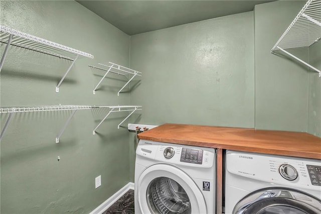 washroom with laundry area and washer and dryer
