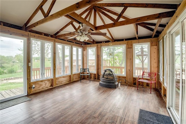 sunroom / solarium with lofted ceiling with beams and wood finished floors