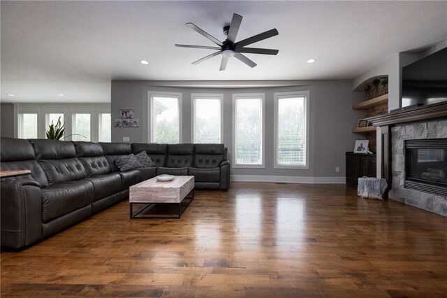 13017 Kelli Dr, Kearney, MO 64060 - living room featuring ceiling fan, wood finished floors, recessed lighting, a tile fireplace, and baseboards