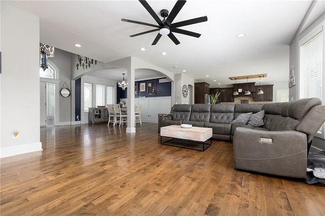 13017 Kelli Dr, Kearney, MO 64060 - living room with arched walkways, ceiling fan, wood finished floors, a chandelier, and recessed lighting