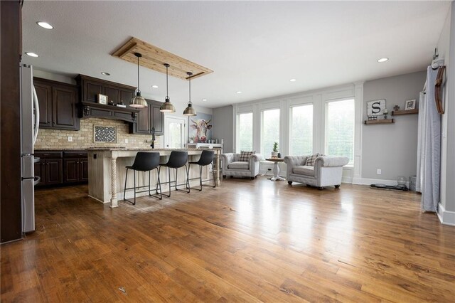 13017 Kelli Dr, Kearney, MO 64060 - living room with dark wood-type flooring, recessed lighting, and baseboards