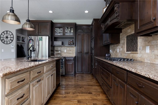 13017 Kelli Dr, Kearney, MO 64060 - kitchen featuring stainless steel appliances, dark wood-style floors, dark brown cabinets, light stone countertops, and decorative backsplash
