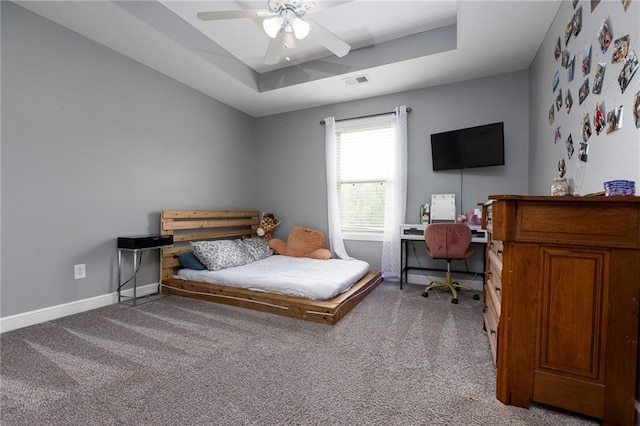 13017 Kelli Dr, Kearney, MO 64060 - bedroom featuring carpet floors, a tray ceiling, baseboards, and a ceiling fan